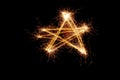 Sparkler firework light with star shape isolated on black background. Royalty Free Stock Photo