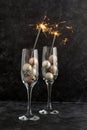 Sparkler firework with two wine glasses, abstract party or Christmas background Royalty Free Stock Photo