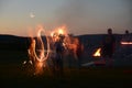 Sparkler fun at a family summer campfire Royalty Free Stock Photo