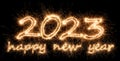 2023 sparkler golden number with happy new year eve greetings bright gold fireworks display black. dark celebration change of the Royalty Free Stock Photo