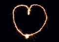Sparkler heart made of fireworks. Good design element for romantic wedding, Valentine's Day or love concept