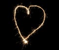 Sparkler heart made of fireworks. Good design element for romantic wedding, Valentine's Day or love concept