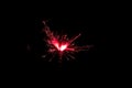 Sparkler in red and white light on a black background Royalty Free Stock Photo