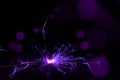 Sparkler in violet and white light on a black background Royalty Free Stock Photo