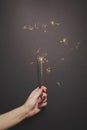 Sparkler in woman hand with red nail polish Royalty Free Stock Photo