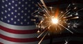 Sparklers on a background of the American flag. Royalty Free Stock Photo