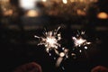 Sparklers on dark night sky