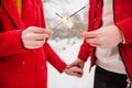 Sparklers and fireworks in the hands of a man and a woman close-up. Royalty Free Stock Photo