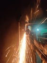 Sparkles coming out of grinder while cutting metal Royalty Free Stock Photo