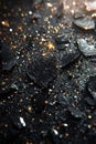 Sparkling black charcoal with golden glimmers. Royalty Free Stock Photo