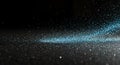 Sparkling blue dust explosion on black background Royalty Free Stock Photo