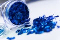 Sparkling blue glitter in a makeup jar Royalty Free Stock Photo
