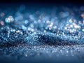Sparkling blue glitter particles creating a shimmering, bokeh-filled surface with soft light reflections and a dreamy, abstract Royalty Free Stock Photo
