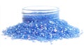 Sparkling Blue Glitter Spilled From A Glass Jar Royalty Free Stock Photo