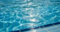 Sparkling Blue Swimming Pool Water with Sun Reflections and Ripples Royalty Free Stock Photo