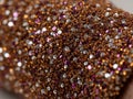 Sparkling brown fabric showcasing glitter and purple sequins Royalty Free Stock Photo