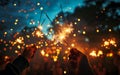 Sparkling Celebration: Hands Holding Sparklers Illuminated in the Night