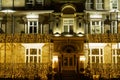 Sparkling Christmas Lights Around the Entrance of a Hotel at Night.