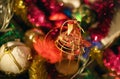 Sparkling christmas tree decorations with tinsels and bokeh