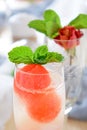 Sparkling cocktail with watermelon and melon ball-shaped pieces and ice Royalty Free Stock Photo