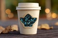 Sparkling Coffee Cup with Leaf Design and Glitter Against a Soft Blurred Background Royalty Free Stock Photo
