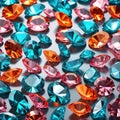 Sparkling crystal gemstones in blue pink and orange, faceted gem background