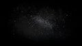 Sparkling dust particles floating in dark space Royalty Free Stock Photo