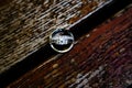 Sparkling engagement rings lying on a polished wooden surface