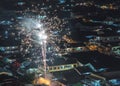 Sparkling firework bursting above Asian neighbourhood