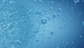 Sparkling Fizz Bubbles on Blue Background - Shallow Depth of Field Royalty Free Stock Photo