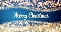 Sparkling gold and silver xmas lights with Merry Christmas greeting message on red background,snow,bright lights Royalty Free Stock Photo