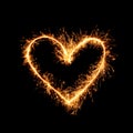 Sparkling golden heart isolated on black background