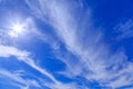 Sparkling hiightlight of the sun on blue sky background and white clouds