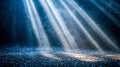 Sparkling illuminated dust particles with dramatic light beams against a dark background Royalty Free Stock Photo