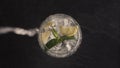 Sparkling lemon ice mint cocktail closeup. Making cocktail process concept