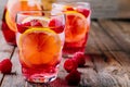 Sparkling Lemon Raspberry Lemonade Sangria in glass on wooden background Royalty Free Stock Photo