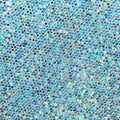 Sparkling light blue sequins texture. Bright blurred background with rainbow glitter Royalty Free Stock Photo