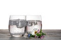 Sparkling mineral drink water in glasses served on table with fl