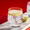 Sparkling mineral drink water in glasses served on table with le Royalty Free Stock Photo