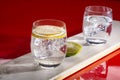 Sparkling mineral drink water in glasses served on table with le Royalty Free Stock Photo