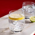 Sparkling mineral drink water in glasses served on table with le Royalty Free Stock Photo