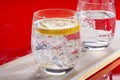 Sparkling mineral drink water in glasses served on table with le Royalty Free Stock Photo