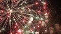 Sparkling red green yellow celebration fireworks over starry sky. Independence Day, 4th of July, New Year holidays salute Royalty Free Stock Photo