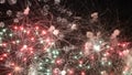 Sparkling red green yellow celebration fireworks over starry sky. Independence Day, 4th of July, New Year holidays salute Royalty Free Stock Photo