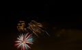 Sparkling red green yellow celebration fireworks over starry sky. Independence Day, 4th of July, New Year Royalty Free Stock Photo