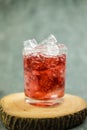 Sparkling red water soda with ice cubes. Summer iced drink Royalty Free Stock Photo