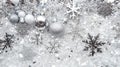 Sparkling silver holiday decorations on a bed of snow-like crystals Royalty Free Stock Photo