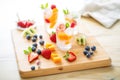 sparkling water with fruit ice cubes on a wooden board Royalty Free Stock Photo