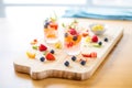 sparkling water with fruit ice cubes on a wooden board Royalty Free Stock Photo