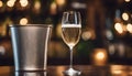 Sparkling wine bottle in ice bucket on blurred restaurant background Royalty Free Stock Photo